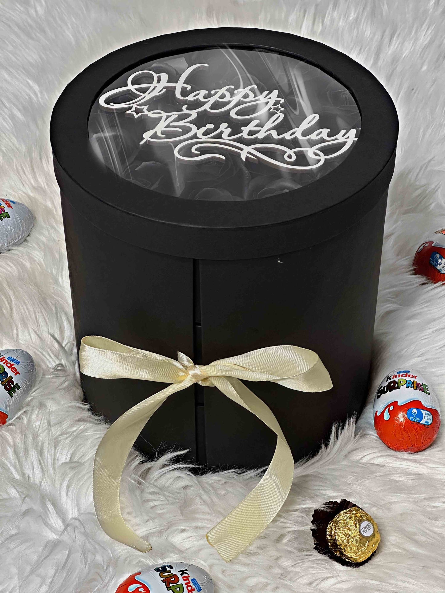 Side view of the three-tiered black gift box showcasing elegant soap roses, Ferrero Rocher, and Kinder sweets. Perfect for special occasions and heartfelt moments.